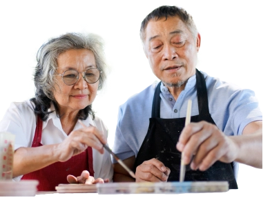 Senior couple learning how to make pottery